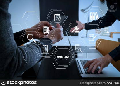 Compliance Virtual Diagram for regulations, law, standards, requirements and audit.co working team meeting concept,businessman using smart phone in modern office