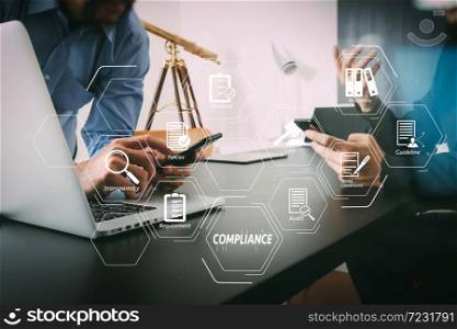 Compliance Virtual Diagram for regulations, law, standards, requirements and audit.co working team meeting concept,businessman using smart phone and digital tablet and laptop computer in modern office