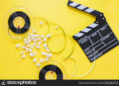 composed clapboard with reels