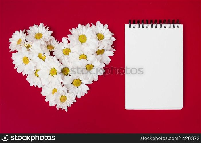 composed heart shaped flowers notepad