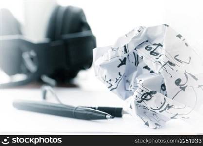 composing music concept with shallow DOF evenly matched crumpled musical notes paper