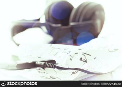 composing music concept with shallow DOF evenly matched jack of headphone and copy space