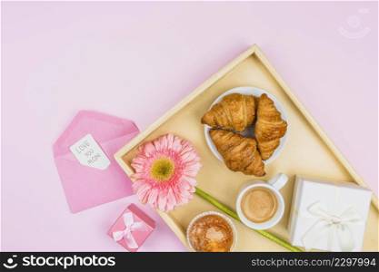 composition bakery flower present tray near envelope with tag