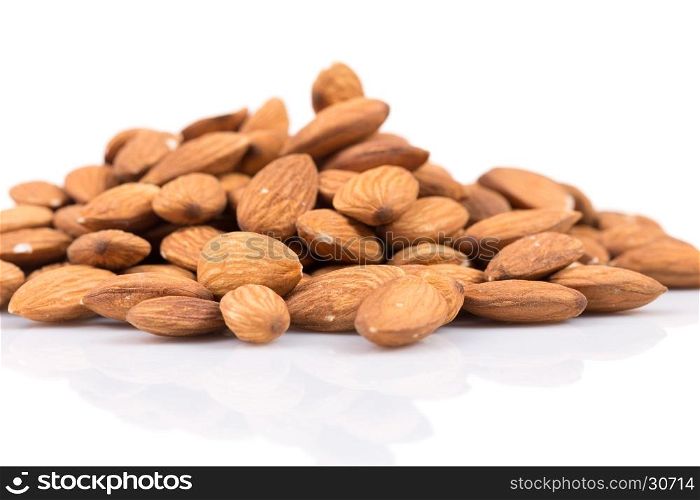 Composition from almond nuts isolated on white background