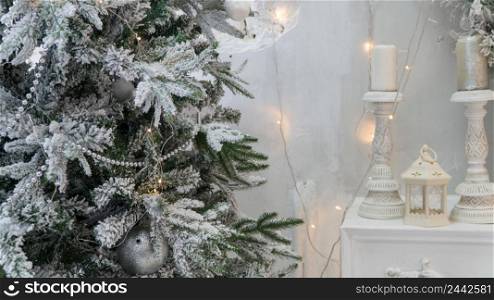 composition of Christmas decorations with fir tree and garlands. the sparkling lights. bright Christmas decorations