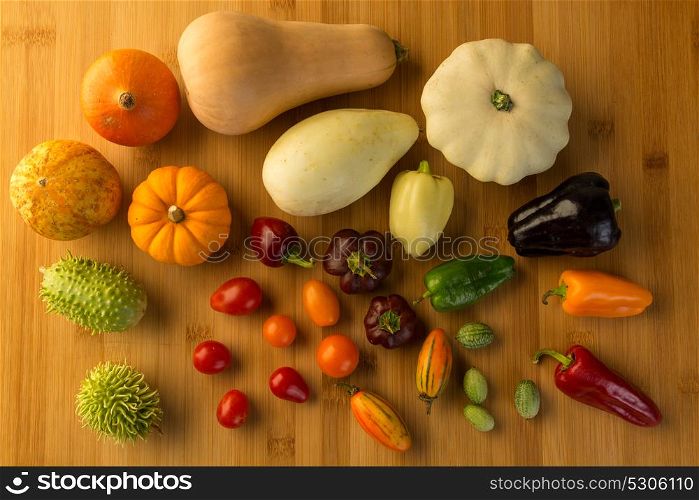 composition of different kind of vegetables on wood background