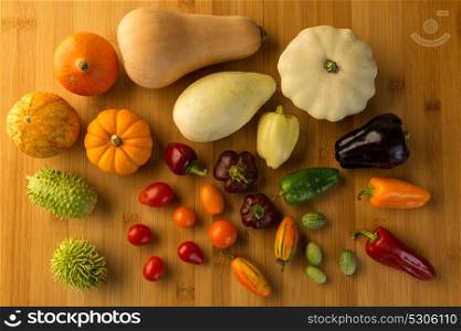 composition of different kind of vegetables on wood background