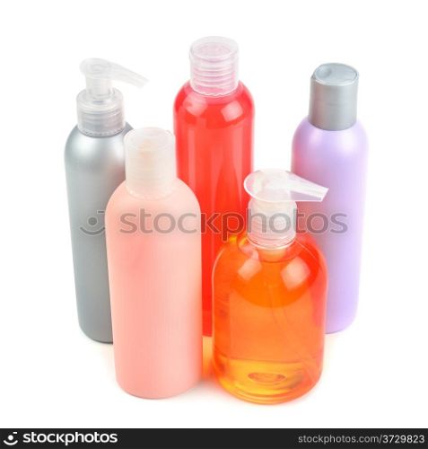 Composition of shampoo bottles and soap dispensers isolated on white background