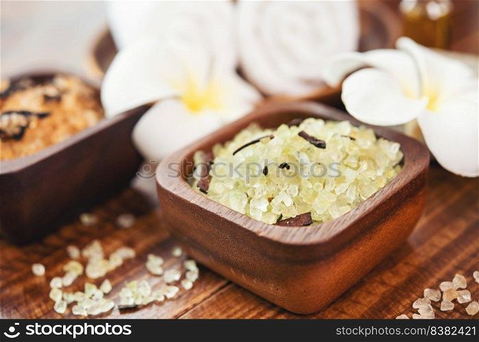 Composition of spa treatment. Natuaral cosmetics with pink himalayan spa salt. Sea bath salt for spa relaxation on wooden background.