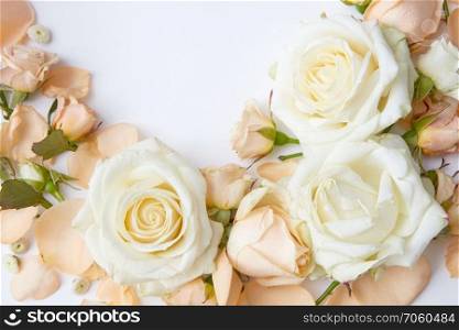 Composition of tender flowers over white background. Flowers and leaves