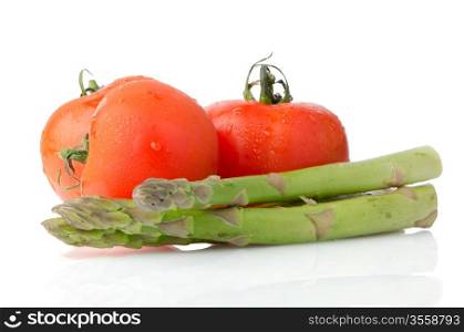 Composition of: tomato and asparagus Isolated on white background.