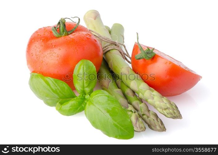 Composition of: tomato, asparagus and basil leaves Isolated on white background.
