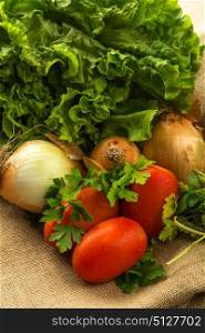 composition of vegetables, tomato, onions, lettuce and basil