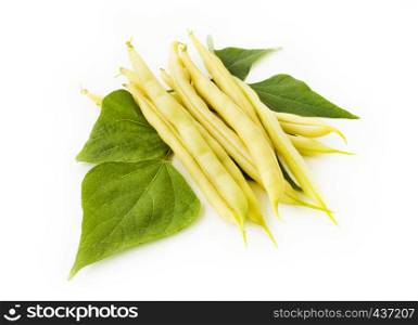 Composition of yellow beans with leaves isolated on white background