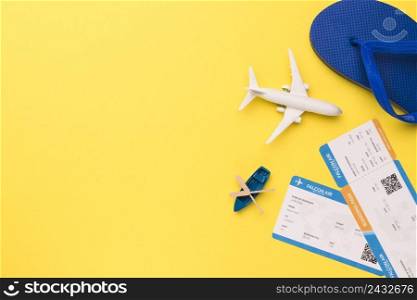 composition toy airplane boat tickets flip flops