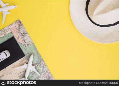 composition toy airplane bus passport map hat