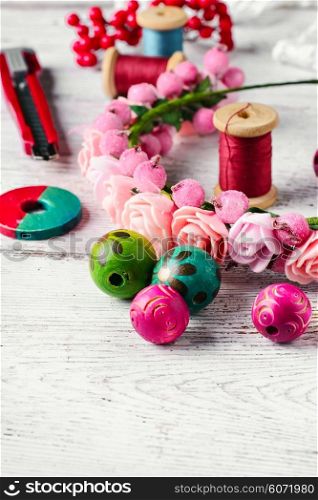 composition with beads and embellishments for needlework in bright colors. Handcraft jewelry