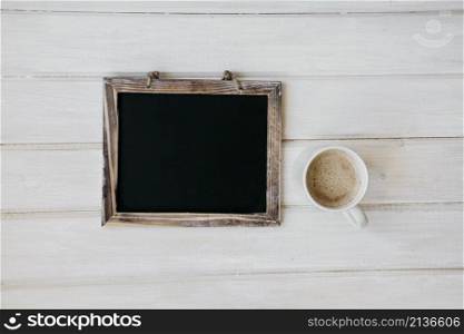 composition with blackboard coffee mug