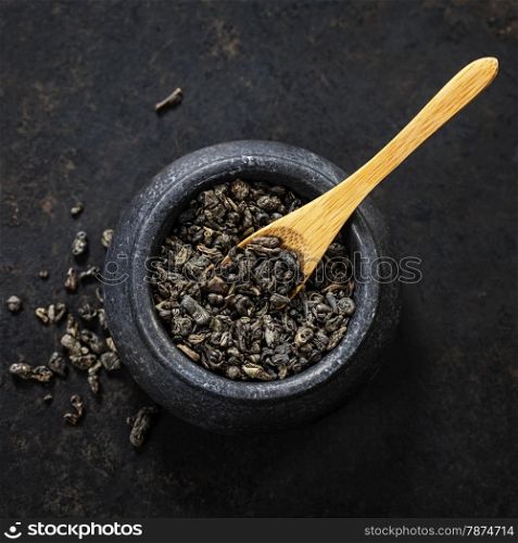 Composition with dry tea on dark background