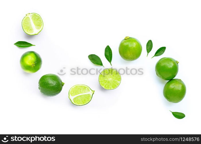 Composition with fresh ripe limes on white background. Copy space