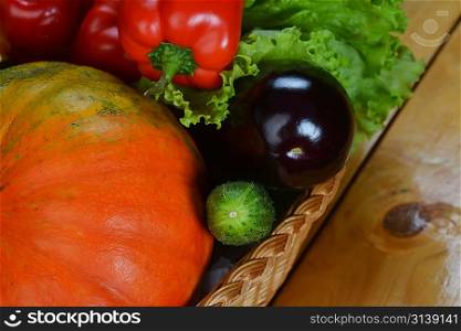 Composition with fresh vegetables closeup on wooden board