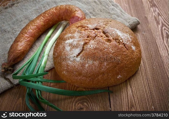 Composition with salami sausages with fresh country bread .farm-style
