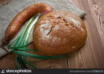 Composition with salami sausages with fresh country bread .farm-style