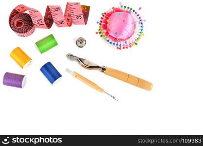 Composition with threads and sewing accessories isolated on white background. Sewing pattern. Flat lay, top view. Free space for text.