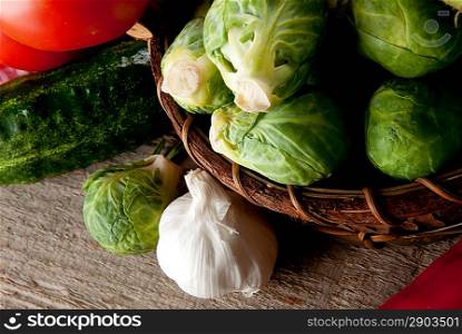 Composition with vegetables on wooden board