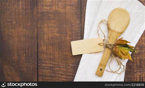 composition with wooden spoon leaf