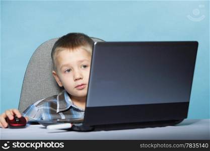 Computer addiction child boy with laptop notebook blue background