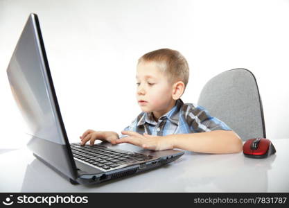 Computer addiction child boy with laptop notebook white background