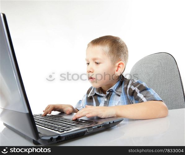 Computer addiction child boy with laptop notebook white background