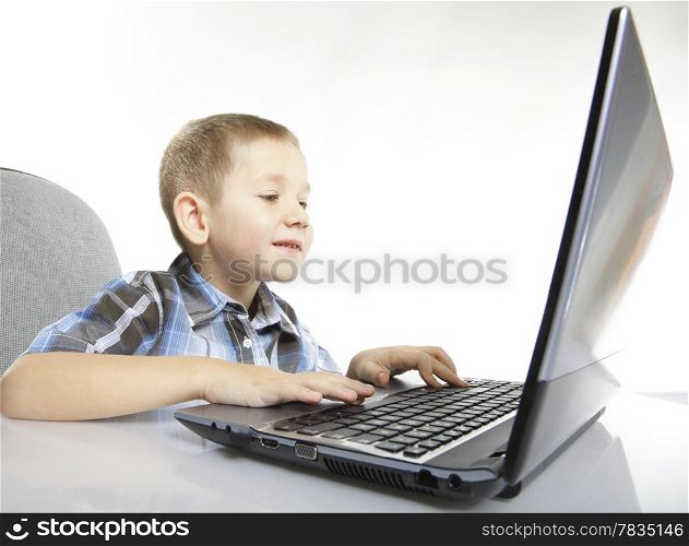Computer addiction child boy with laptop notebook white background