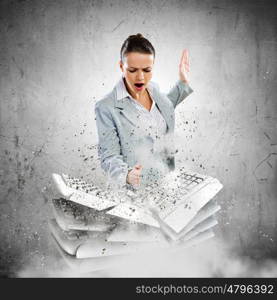 Computer addiction. Image of businesswoman crushing with hand pile of keyboards