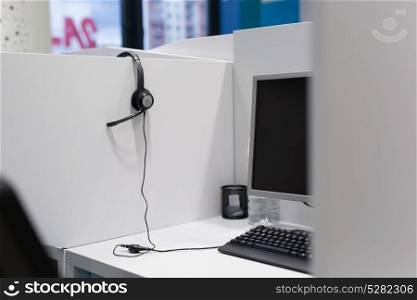 Computer and headset in empty call center office