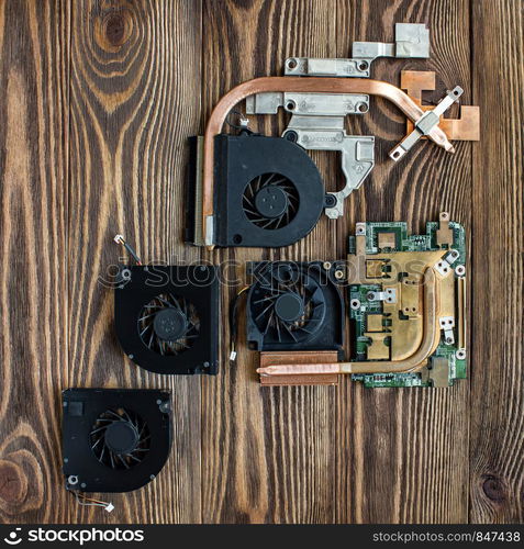 computer cooling fans on wooden background.cooling system board. computer cooling fans on wooden background.