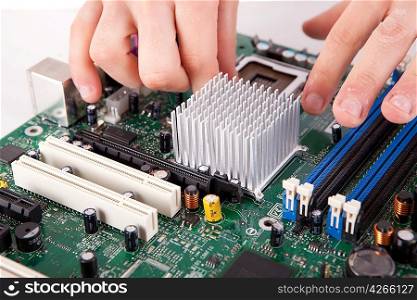 Computer engineer working on an old motherboard