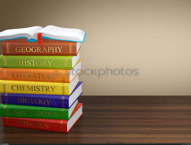 Computer generated image of multi colored book stack on wooden table. Education concept.