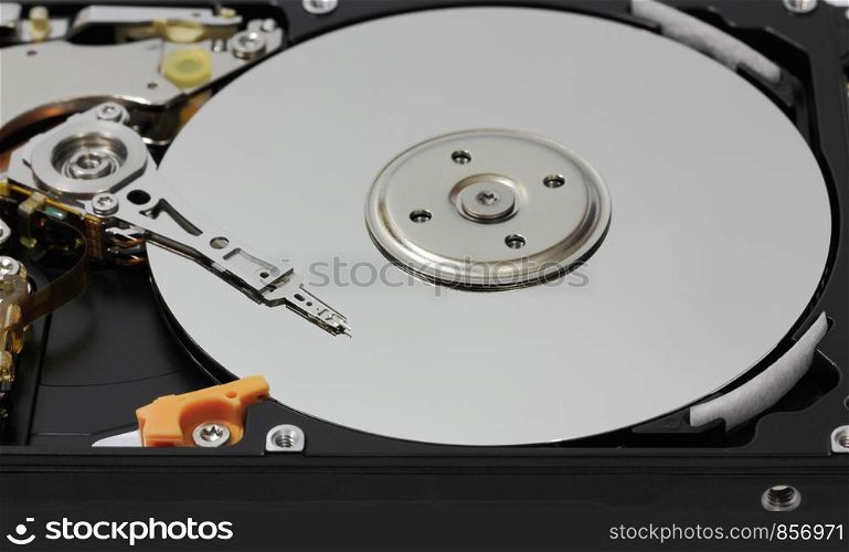 Computer hard disk drive with magnetic head.