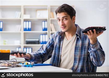 Computer hardware repair and fixing concept by experienced technician. Computer hardware repair and fixing concept by experienced techn