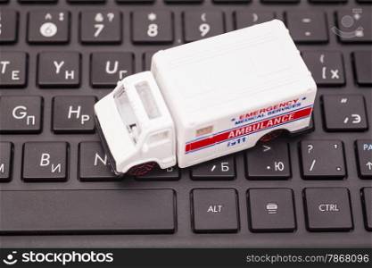Computer keyboard and Toy ambulance car