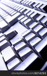 Computer keyboard close up in blue light