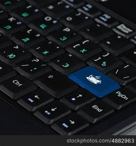 Computer keyboard with coffee symbol on it