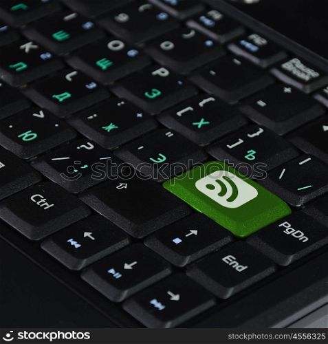 Computer keyboard with communication symbol on it