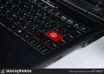 Computer keyboard with global web symbol on it