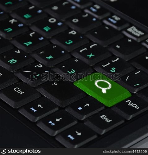 Computer keyboard with internet search symbol on it