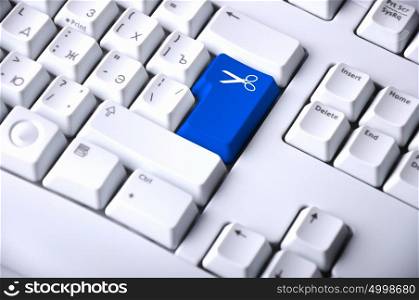 Computer keyboard with scissors symbol on it