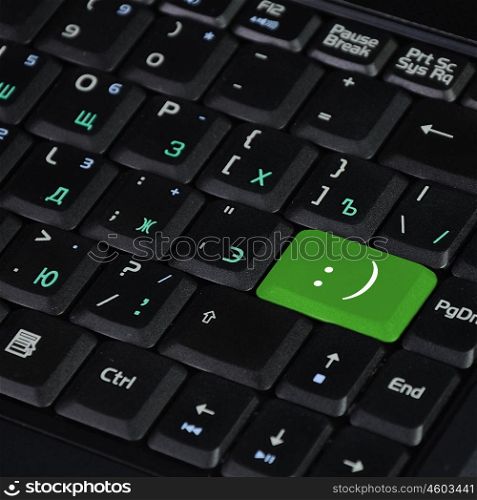 Computer keyboard with smile symbol on it