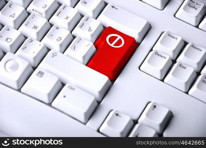 Computer keyboard with stop sign on it